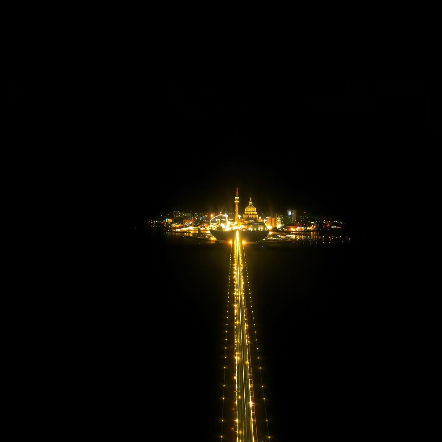 Ethereal City Reflection: Infinite Red, White, Yellow Navigation Lights in Still Water
 | Unfold Lens