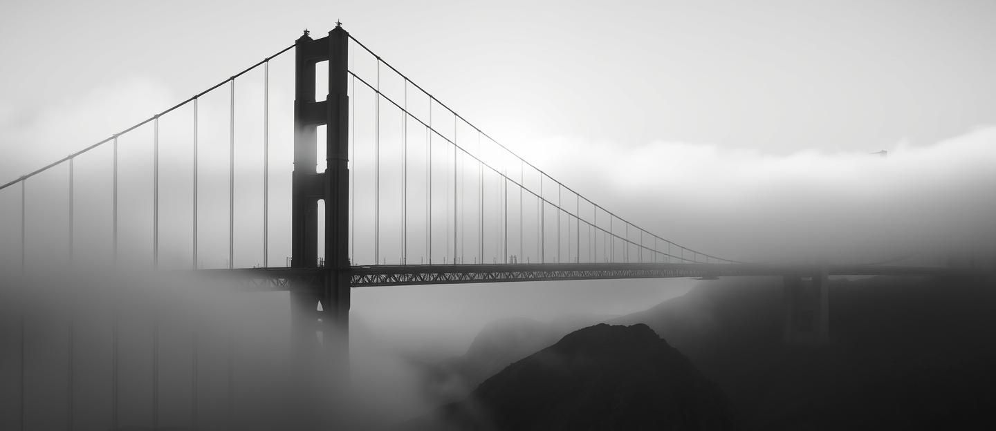 Golden Gate Bridge Fogscape: Minimalist Dawn Serenity in Black and White 
 | Unfold Lens